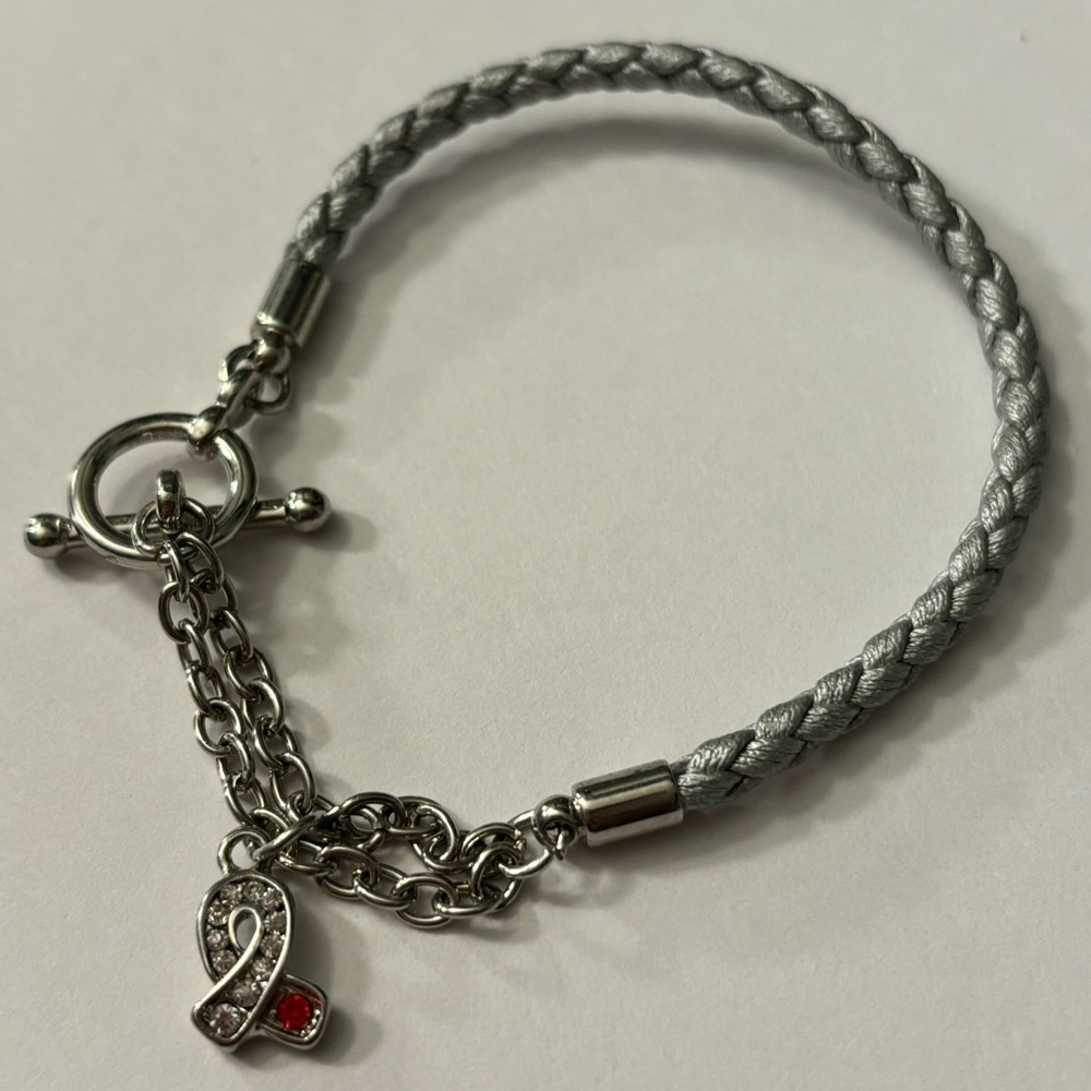 Light Blue Braided Bracelet W/ A Silver & Red Gemstone Awareness Ribbon Charm